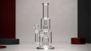 A double-chamber bong shown in full profile with two reservoirs and connecting passage visible