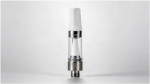 Ceramic core vape cartridge on a clean neutral background