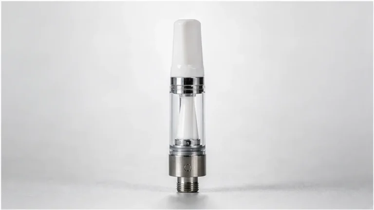 Ceramic core vape cartridge on a clean neutral background