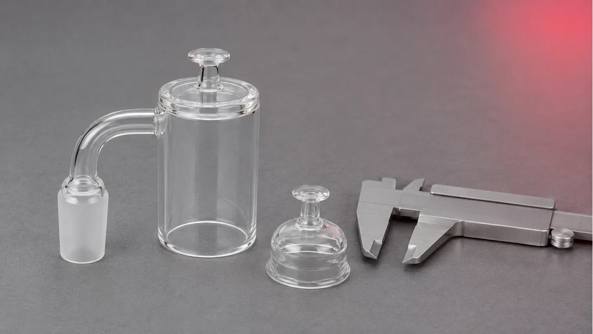 Quartz banger and carb cap beside calipers
