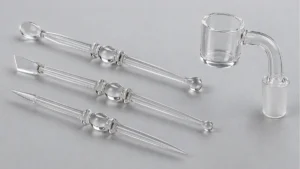 Quartz dab tools with different tip profiles beside a quartz banger