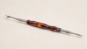 Double-ended resin-handled dabbing tool