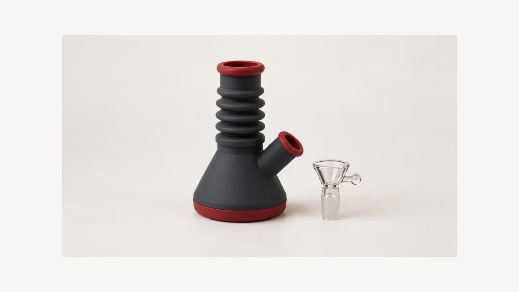 Accordion silicone body beside a separate clear glass bowl