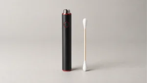 Unbranded 510 battery beside a dry cotton swab