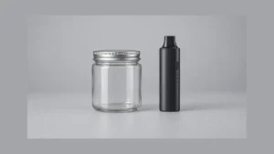 Closed empty glass storage jar beside an unpowered dry herb vaporizer