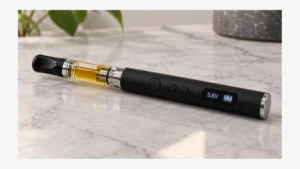 Digital 510 battery showing 3.2 volts beside an oil cartridge