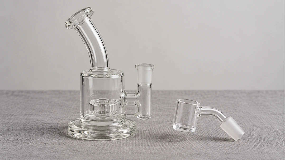 Empty clear dab rig with a separate intact bucket banger