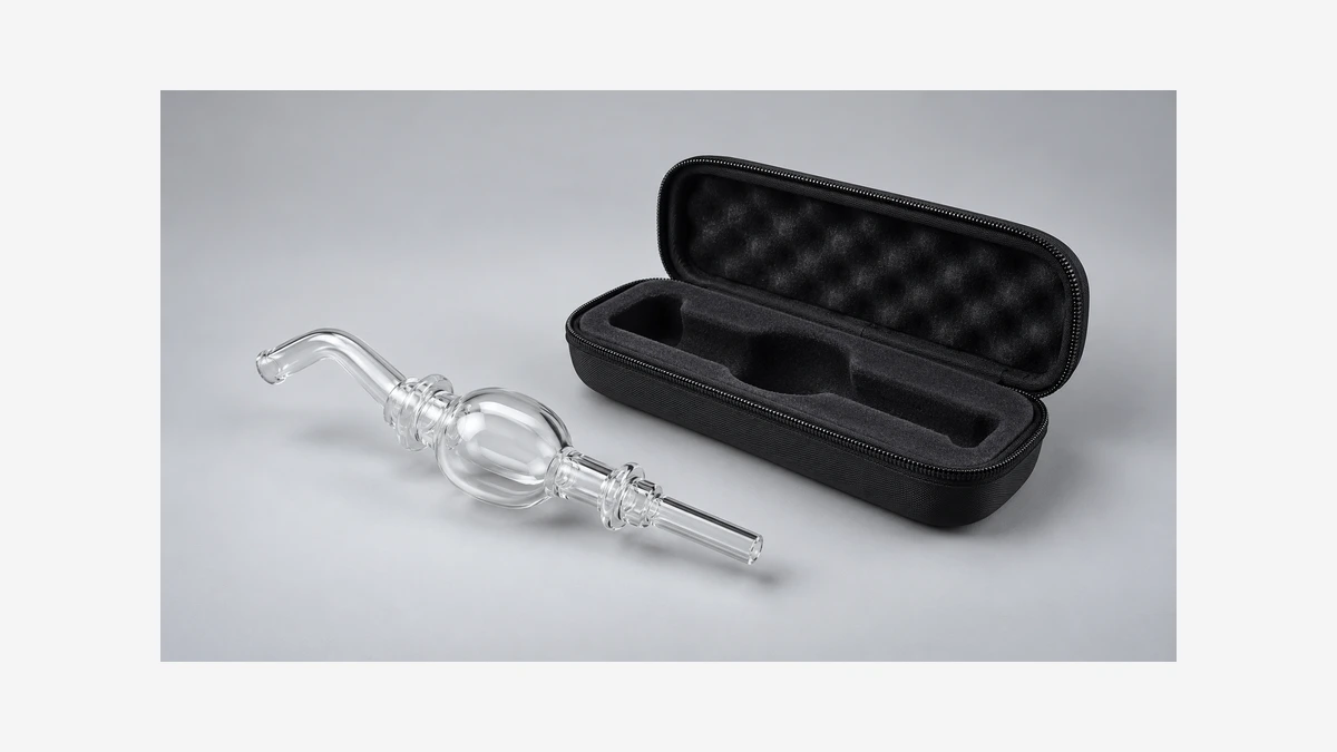 Empty glass nectar collector beside an open case