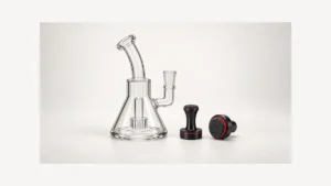 Empty glass rig beside separate padded magnetic cleaner components