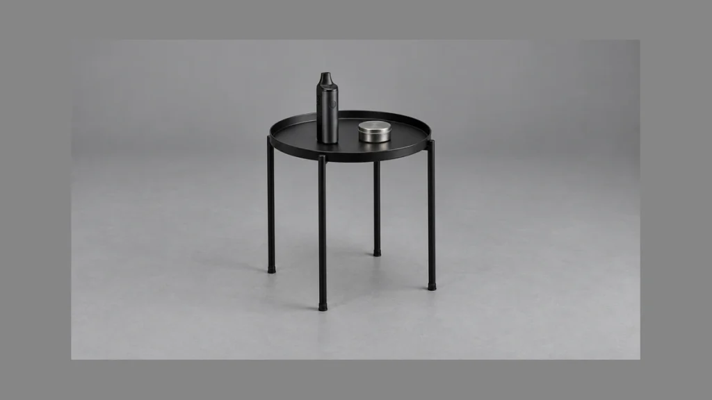 Freestanding raised edge side table with vaporizer and closed parts tin