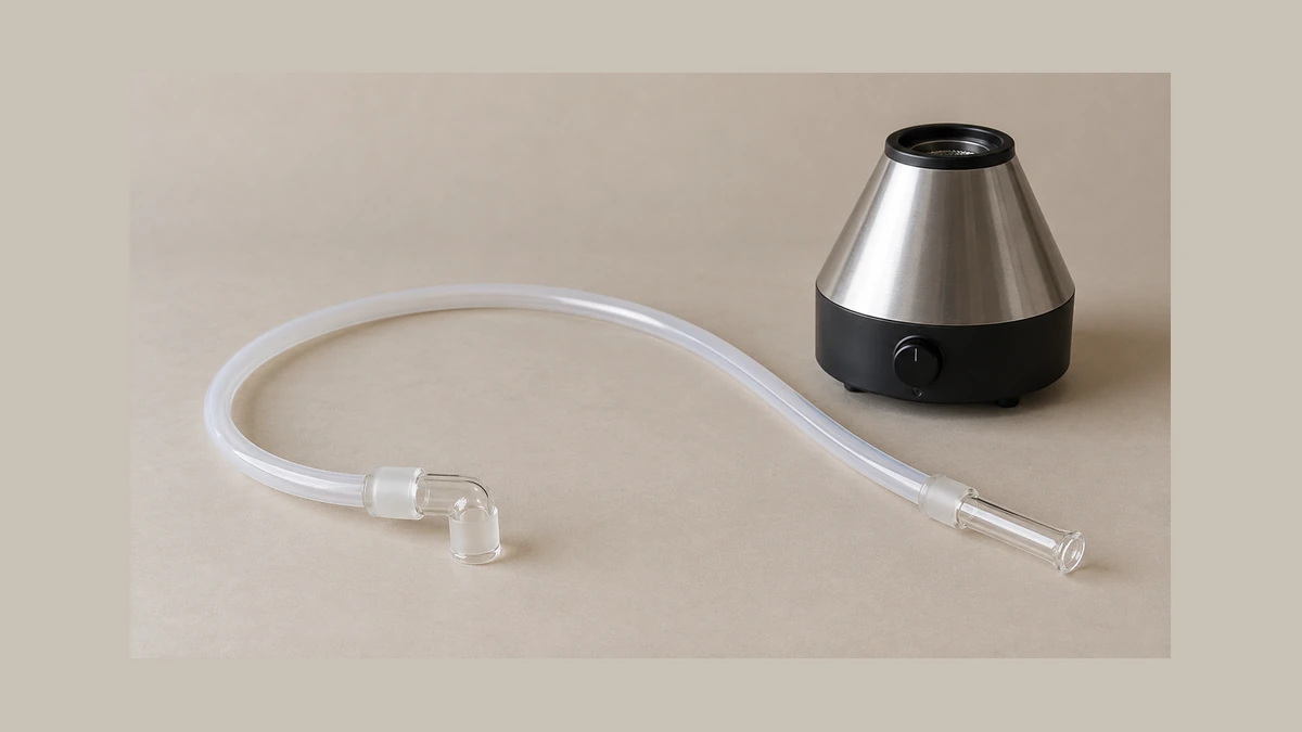 Loose vaporizer whip hose and glass fittings beside a desktop unit Loose vaporizer whip hose and glass fittings beside a desktop unit