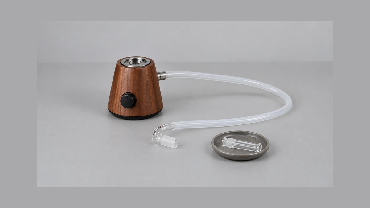 Loose whip hose and detached glass elbow beside an unpowered desktop unit Loose whip hose and detached glass elbow beside an unpowered desktop unit