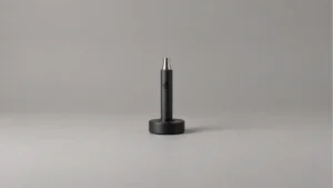 Powered off solid body wax pen in a broad passive desktop holder
