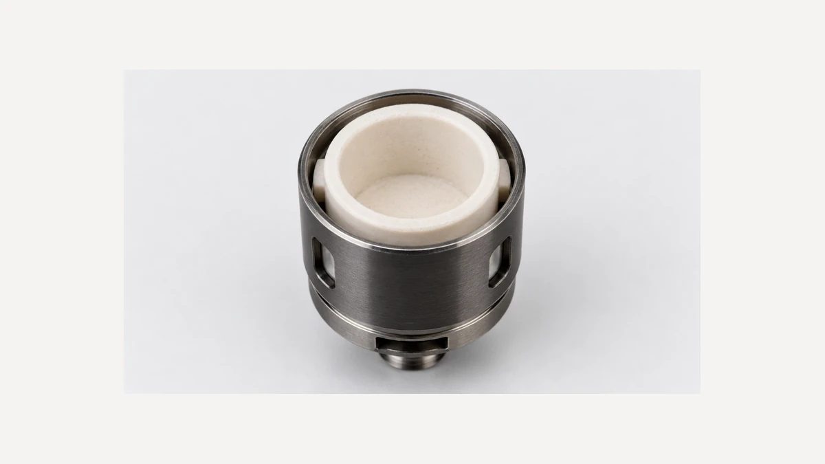 Close view of a generic pale ceramic bowl within a dark atomizer housing