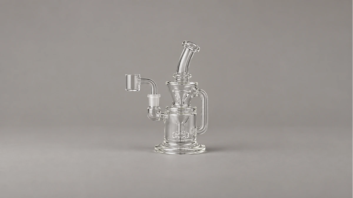 Rear view of a small clear recycler rig showing connected chambers